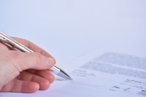 close-up-of-the-signing-of-a-contract_1161-97